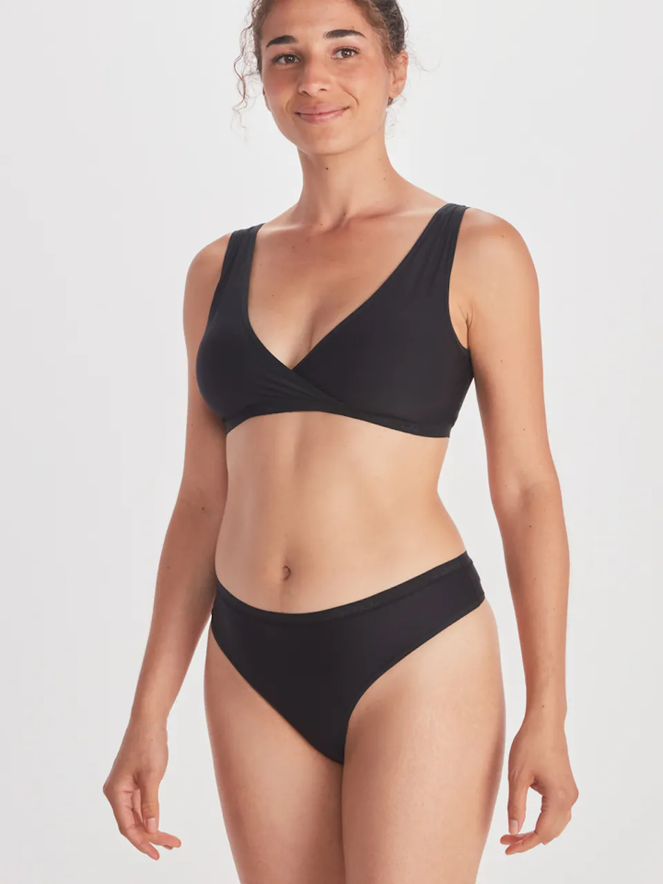 side of women's brief and bra on model