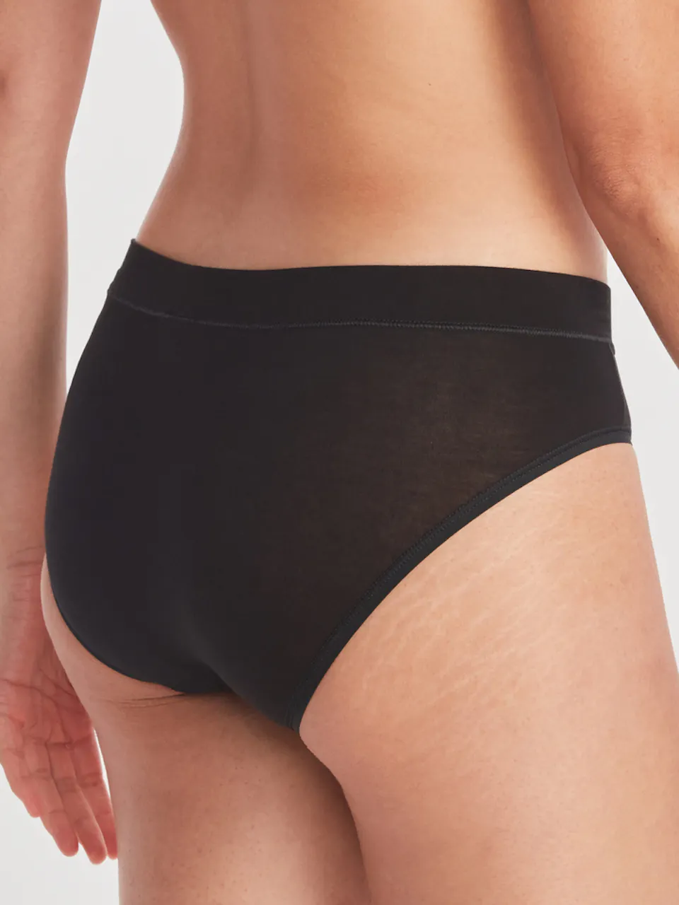 back of women's brief underwear on model