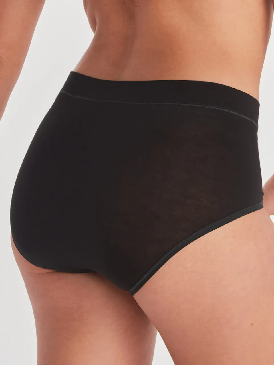 back of women's high waisted brief on model